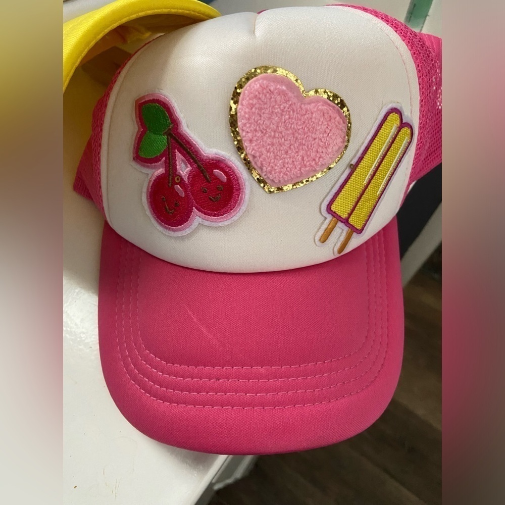 Trucker hat pink and white w patches on it summery
